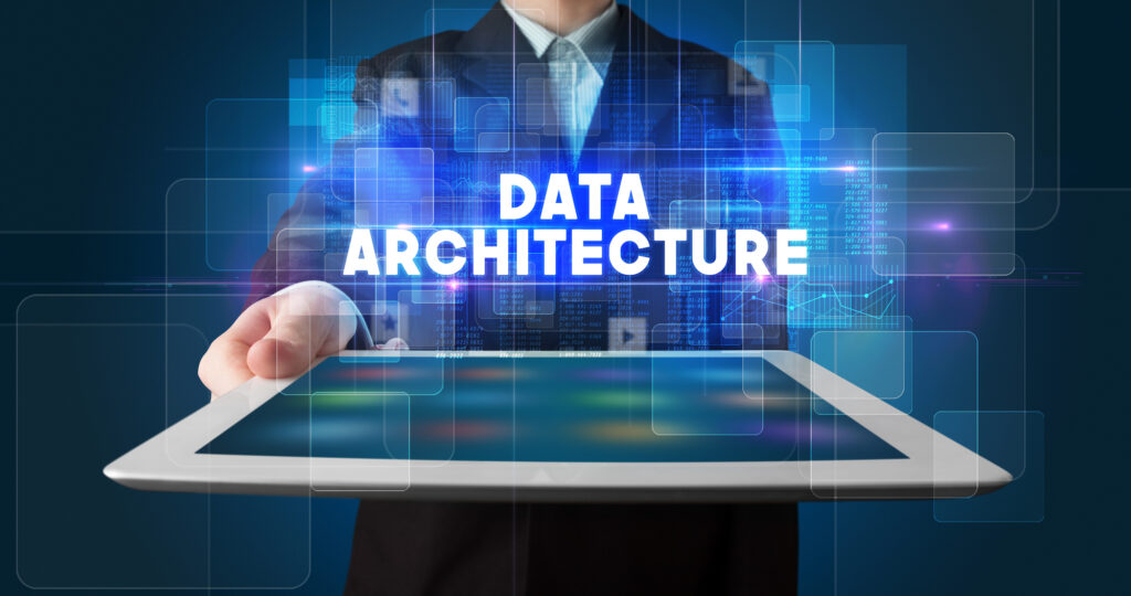 Businessperson holding a tablet with a data architecture interface, representing enterprise integration design and vendor decoupling.