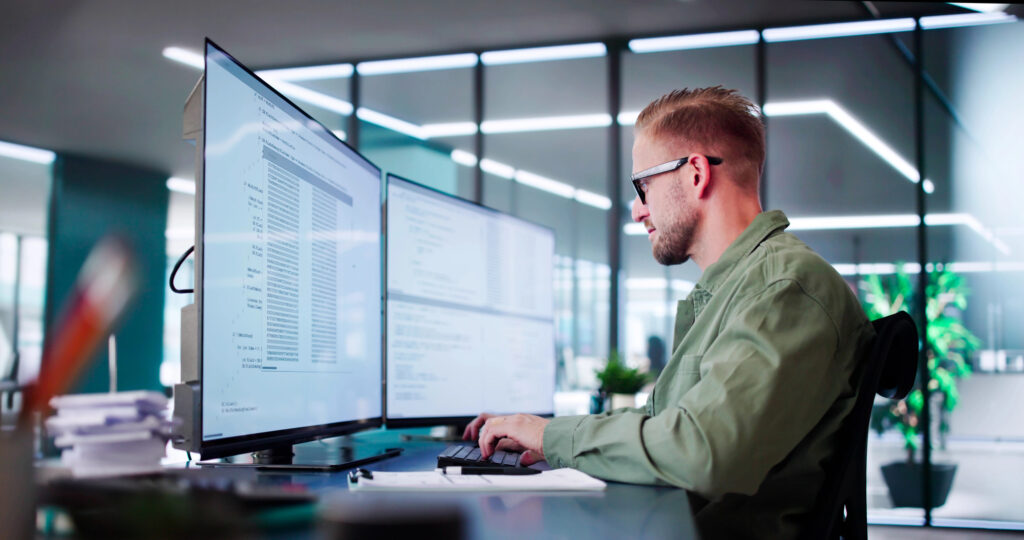 Senior software engineer reviewing application code.